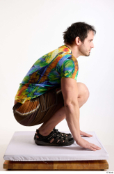 Whole Body Man White Casual Shorts Average Parrot Kneeling Studio photo references